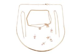 A collection of jewellery items; including a curved bar necklace, to a trace chain marked '10K'; a p
