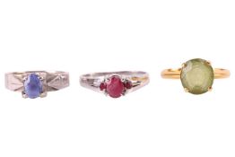 Three gem-set rings; comprising a peridot ring, set in yellow metal tested as 18ct gold, size M1/2; 