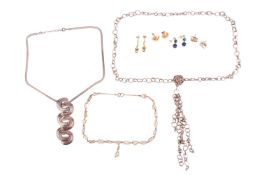 A collection of jewellery items comprising a pair of 9ct gold earrings, of stylised floral design, a