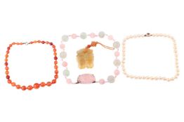 A rose quartz and fluorite necklace; a single-strand of agate beads and a jade pendant the strung ro