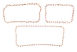 Two cultured pearl necklaces and an imitation pearl necklace; to include a closed necklace strung wi