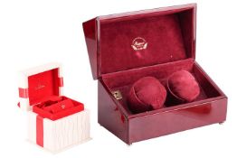 An Omega watch box with a watch cushion and pouch in an outer Omega box with an instruction manual a