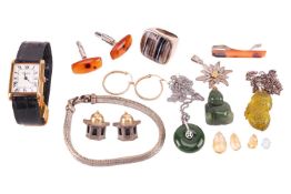 A small collection of jewellery items; including examples of carved nephrite pendants, a pair of Vic