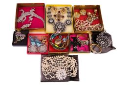 A collection of Butler and Wilson costume jewellery including a gem-set pansy brooch, a large salama