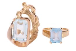 An abstract cocktail ring set with a pale blue paste, to a textured mount leading to D-profile shank