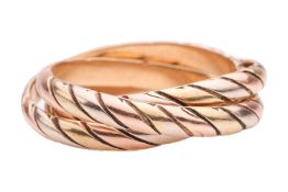 A tri-colour trilogy band, featuring three interlocking court-shaped bands with a ridged design, tes