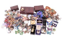 A large quantity of costume jewellery to include paste set butterfly brooches, beaded necklaces, ena
