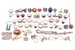 A large quantity of rings, cufflinks and brooches; to include examples of a carved coral face ring, 