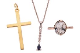 Two pendants and a ring; including a cross pendant with grooved detail in yellow metal marked 'W.Ger