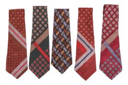 A group of five silk ties by Yves Saint Laurent, of geometric polychromatic designs. (5)