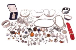 A collection of miscellaneous jewellery items; including examples of several ethnic white metal neck