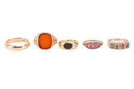 Four gem-set rings and a wedding band; including a signet ring set with a carnelian panel, in yellow