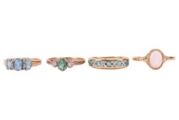 Four gem-set rings in 9ct gold; including a greenish-blue aquamarine and diamond trilogy ring in siz