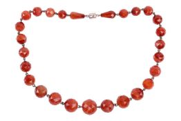 A carnelian bead necklace, comprising an array of faceted banded agate beads, size graduated from 20