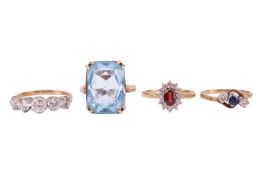 Four 9ct gold gem-set rings; to include a sapphire and diamond three-stone crossover ring, size K½; 