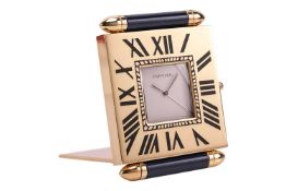 A Must de Cartier travel clock; the 23mm x 23mm white dial with faceted lozenge hands, within a Roma