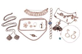 A group of white metal jewellery items; to include a floral filigree set comprising a brooch, a pair