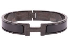 Hermès - a narrow 'Clic HH So Black' bracelet with matte enamel and plated hardware, signed and mark