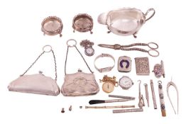 A silver sauce boat, a pair of silver cauldron salts, silver wish-bone sugar tongs, two silver plate