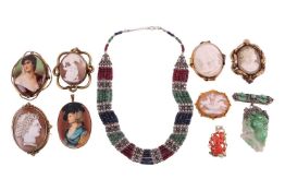 A collection of jewellery items, comprising four shell cameo brooches, in yellow metal mounts tested