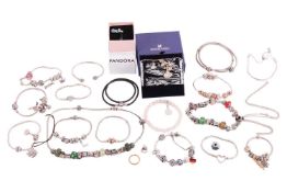 A collection of branded jewellery items including a Swarovski gingko bracelet, with original tags in