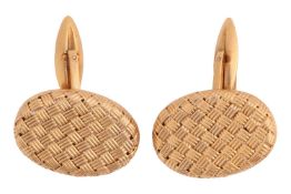 A pair of cufflinks; with oval basket weave plaques to one side and hinged bar link connections with