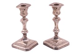 A pair of early 20th-century table candlesticks, Sheffield 1921 by Thomas Bradbury and Co, the squat