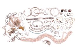 A collection of silver and white metal jewellery items including two Gucci rings, seven bangles, a g