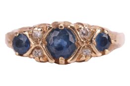 A sapphire and diamond 9ct gold ring, one central claw-set sapphire flanked by two smaller sapphires