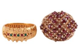 A 9ct gold garnet cluster ring and a yellow metal gem set ring; The 9ct gold garnet cluster ring of 