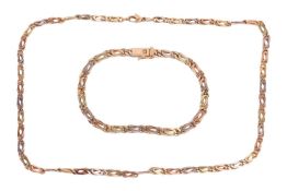 A tri-colour necklace and matching bracelet, with a fancy-link chain, the bracelet featuring a push 