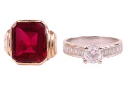 Two gem set rings; A cubic zirconia solitaire ring with baguette-cut cubic zirconia channel-set shou