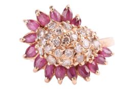 A ruby and diamond-set dress ring, of asymmetrical design, the bombe-style centre pavé-set with roun