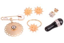 A collection of jewellery items comprising an onyx and diamond-set pendant, marked '18K', an enamel 
