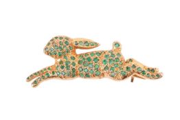 A leaping hare brooch encrusted with circular-cut emeralds and diamond chip as eye, brooch fittings 