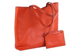 Cartier - a Happy Birthday 'Le 18H' tote bag in tangerine calfskin leather, embossed with double C l