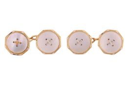 A pair of mother-of-pearl cufflinks, of button form, with partially worn enamel borders, each disc m