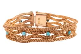 A turquoise-set mesh-style bracelet, featuring four mesh rows, partially connected and interspaced w