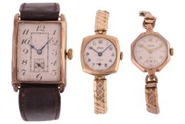 A gentleman's 9 carat wristwatch, in the Art Deco style, bearing foliate scroll decoration to hallma