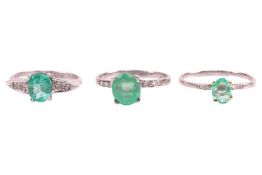 Two emerald rings and one chrysoprase ring; One claw-set oval-cut emerald ring in a navette-shaped s