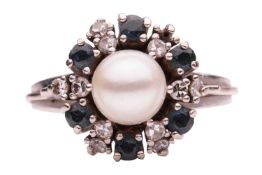 A gem-set cluster ring, centred with a round cultured pearl of 7.3 mm, set within a frame alternatin