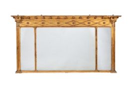 A GILTWOOD AND COMPOSITION OVERMANTEL WALL MIRROR