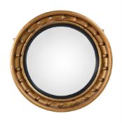 A GILTWOOD CONVEX WALL MIRROR