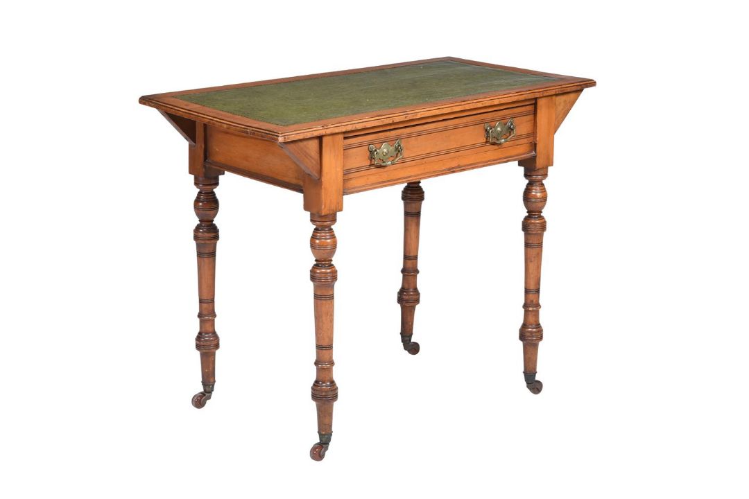 A VICTORIAN MAHOGANY AND LEATHER TOPPED WRITING TABLE