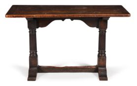A CARVED OAK TAVERN TABLE