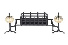 AN ARTS & CRAFTS BLACK PAINTED IRON AND BRASS FIRE GRATE