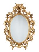 A FLORENTINE GILTWOOD OVAL MIRROR