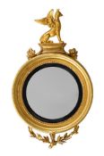A REGENCY GILTWOOD CONVEX WALL MIRROR