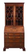 A MAHOGANY AND INLAID BUREAU BOOKCASE IN GEORGE III STYLE