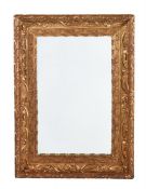 AN ART NOUVEAU GILT COMPOSITION WALL MIRROR